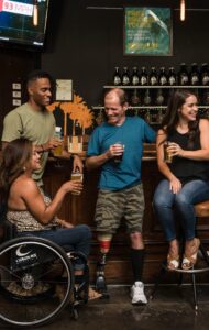 People with disabilities at a bar - Inclusivity in Web Design